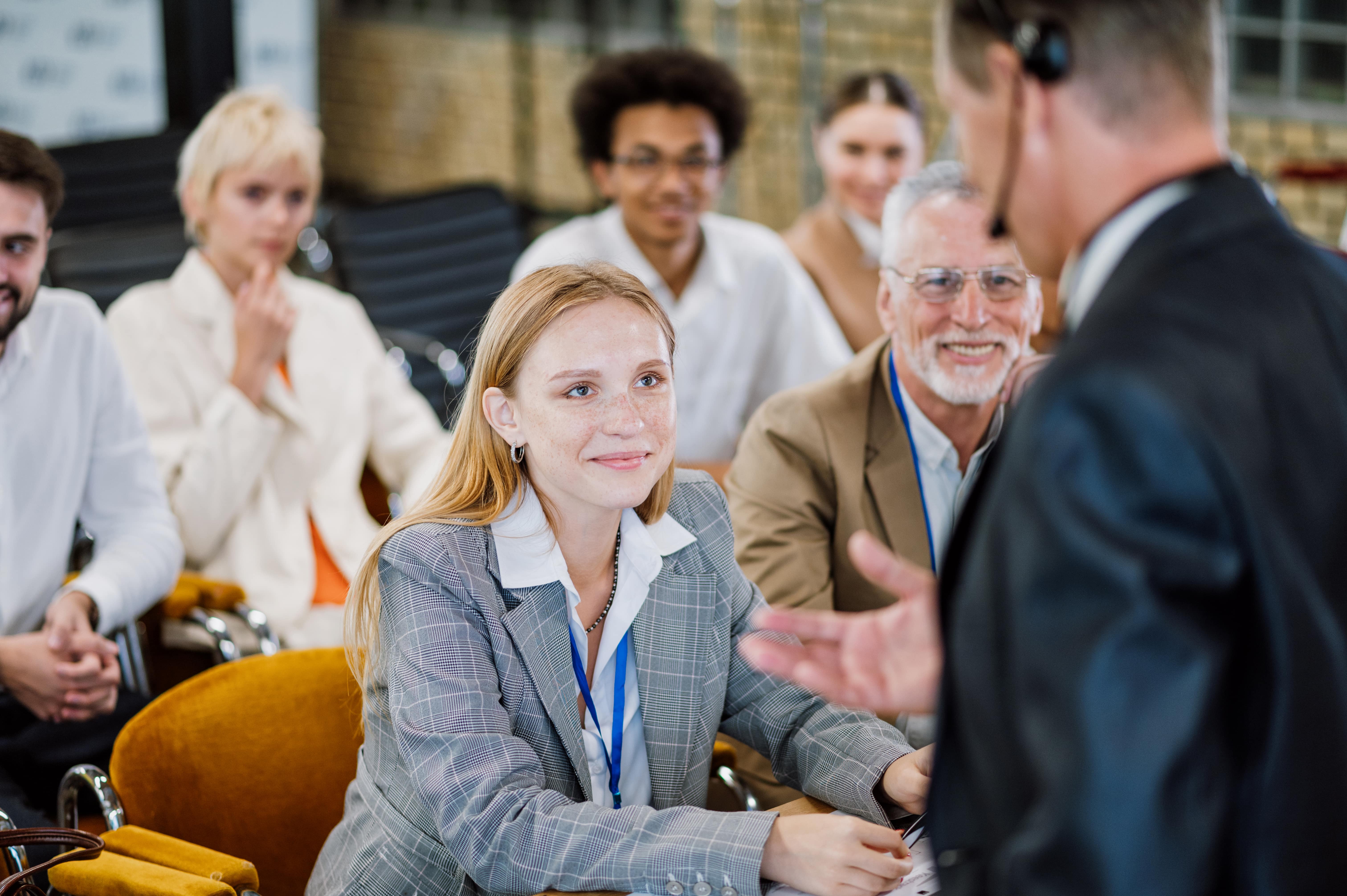 Close-up of a listener emotionally engaged with a speaker