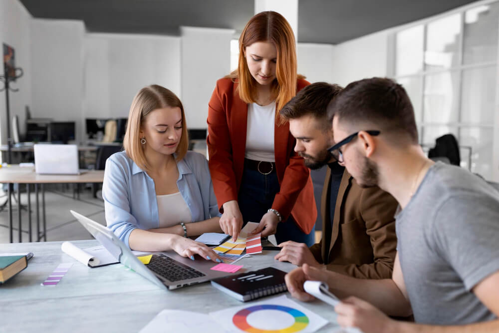 a team in candid conversation or a founder writing notes at their desk